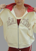 Person wearing a beige and red outfit with 'Gala' text on a white background