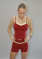 Person wearing a red and white outfit on a white background